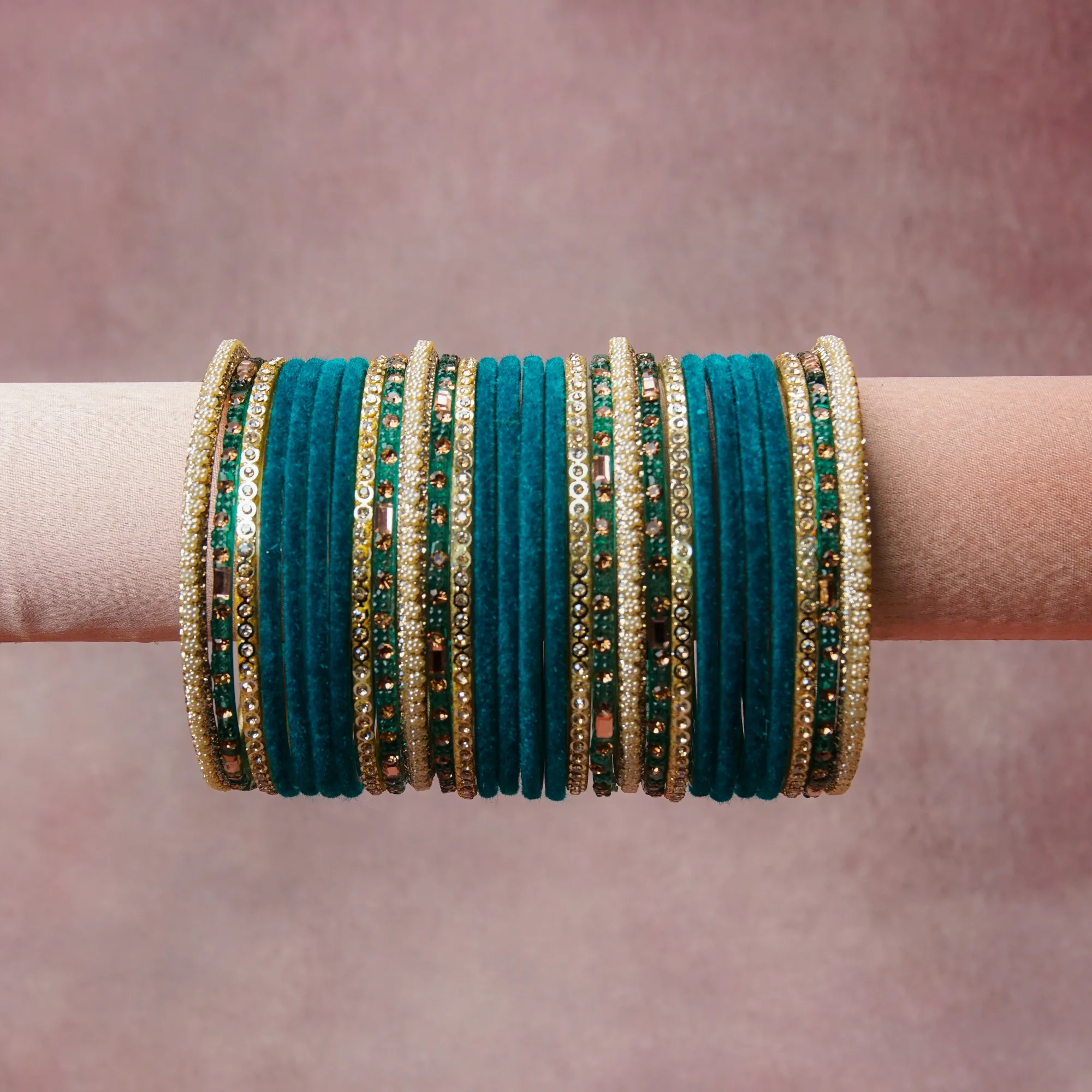 A grounding Teal forms the heart of the set, while touches of Gold, Cream Pearl, Champagne Crystal, Clear Crystal add charm.

A thoughtful composition of Velvet, Gold-Tone Metal, Faux Pearl, Crystal, designed to feel complete without being heavy.
Each element layers seamlessly, creating a look that is refined, wearable and quietly striking.